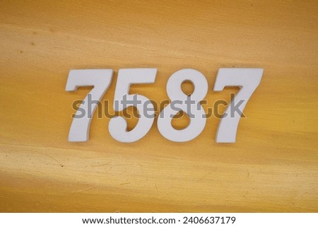 The golden yellow painted wood panel for the background, number 7587, is made from white painted wood.