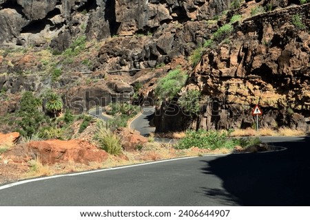 Beautiful mountain road with many hairpin turns in Gran Canaria, Canary Islands, Spain. Royalty-Free Stock Photo #2406644907