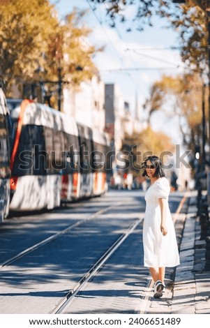 a girl's photo shoot in Istanbul. a girl in a white dress on the background of an Istanbul tram. photos of a tourist in Istanbul. photo shoot of a man in Turkey