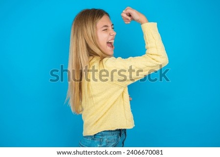Profile photo of beautiful caucasian teen girl supporting soccer team raise fist shouting