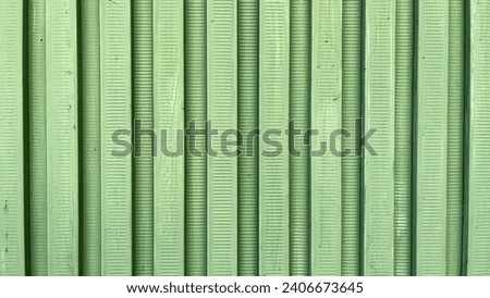 Wall texture made of hard green plastic background