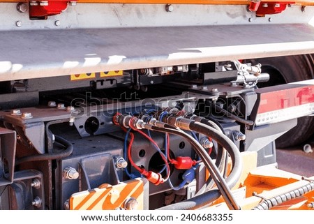 hoses and fittings of hydraulic installation. Royalty-Free Stock Photo #2406683355