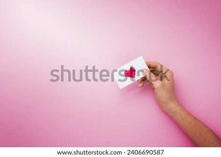 person hand holding paper with heart picture . Resolution and high quality beautiful photo