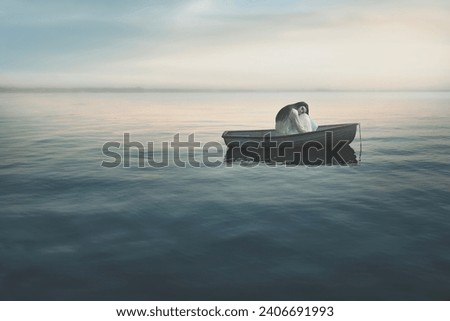 lonely woman on a small boat in the middle of the sea, loneliness concept Royalty-Free Stock Photo #2406691993