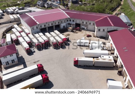 Trucks are in the parking lot of a trucking company. View from above. aerial photography