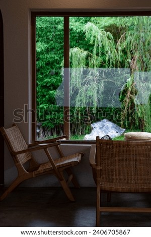 The interior design has Japanese style tables, chairs, windows and views.