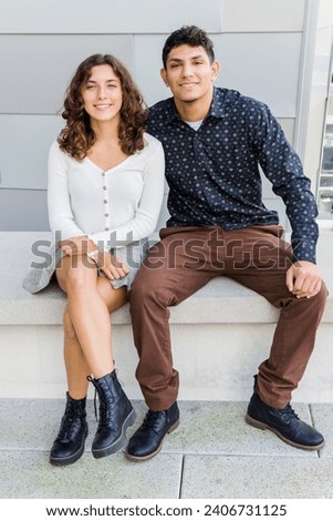 Male and female models together. Hispanic, dressed casually. Royalty-Free Stock Photo #2406731125