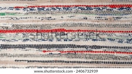 Rags Carpet Texture Background, Woven Rug Pattern, Handmade Recycled Material Mat Mockup, Hand-Woven Rustic Carpet Made of Rags with Copy Space for Text Royalty-Free Stock Photo #2406732939