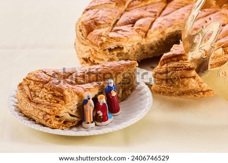 Epiphany cake on wooden table. Galette des rois traditional Epiphany cake in France