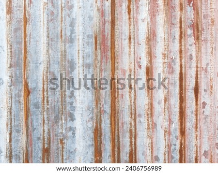 Peeling paint on the steel walls and rust marks. It's a vertical line. It is a beautiful picture in another way.