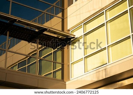 A somewhat abstract photograph of the side of a tall building with a lot of windows.