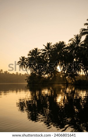Beautiful sunrise lake view from Kavvayi Island Kannur, Kerala nature landscape scenery Royalty-Free Stock Photo #2406801641