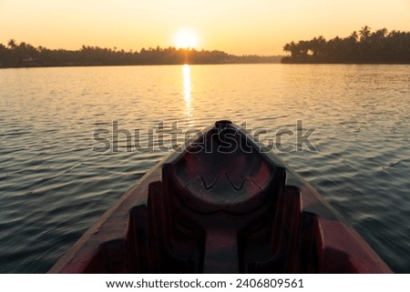 Kayaking in Kerala backwaters, beautiful sunrise view with coconut trees shot from Kavvayi Island Kannur Royalty-Free Stock Photo #2406809561