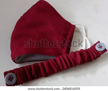 Photo of three-layer cloth mask. Combination of red and white. mask strap connector. home made.