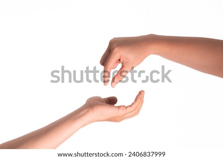 Closeup of female and male arms reaching each other hand isolated on white background