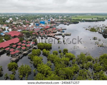 Aerial view of Kereng Bengkirai tourist area in Sebangau national park in Palangkaraya, Central Kalimantan, Indonesia. Sebangau is a protected peat swamp area. Royalty-Free Stock Photo #2406871257