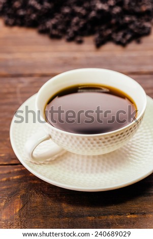 Black coffee cup on wooden background - Vintage effect style pictures