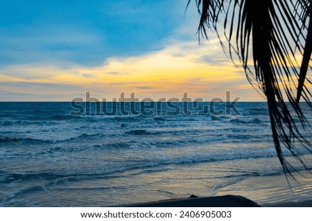 Beautiful sunset landscape, blue sea, ocean waves, tropical island beach, blue yellow sky, reflection on the water, yellow clouds, sunrise, peaceful dawn, seascape scenery, nature.