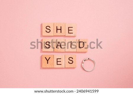 She said yes as engagement announcement Royalty-Free Stock Photo #2406941599