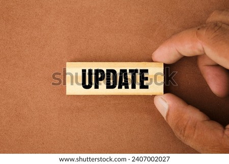 hand holding a stick with the word update. update or renew concept