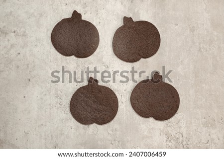Home baked pumpkin shaped chocolate sugar cookies.