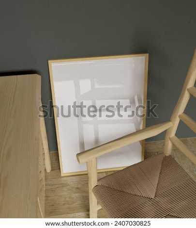 wooden frame mockup poster behind the wooden chair leaning on the green concrete wall with unique shot