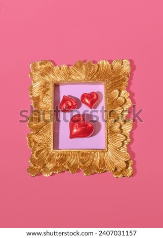 Three Bright Red Hearts in a Gold Antique Victorian Frame Royalty-Free Stock Photo #2407031157