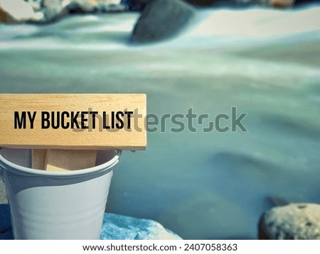 inspirational and motivational words of my bucket list written on wooden block with nature background.