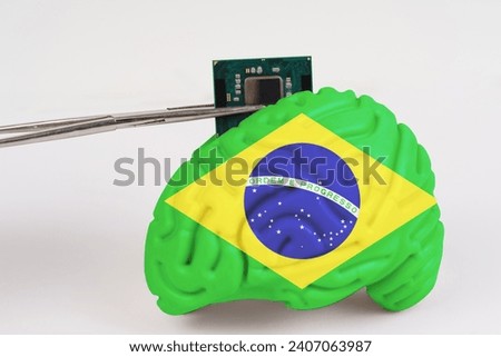 On a white background, a model of the brain with a picture of a flag - Brazil, a microcircuit, a processor, is implanted into it. Close-up