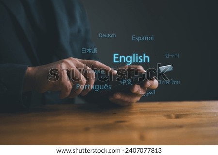 Translator app, language course and e-learning concept. Person use smartphone with Translator app, translation or translate on the mobile app worldwide language conversation speaking concept. Royalty-Free Stock Photo #2407077813