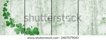 St Patricks day background. Shamrocks over a light green wood background. Decoration for St. Patrick's Day. Banner design