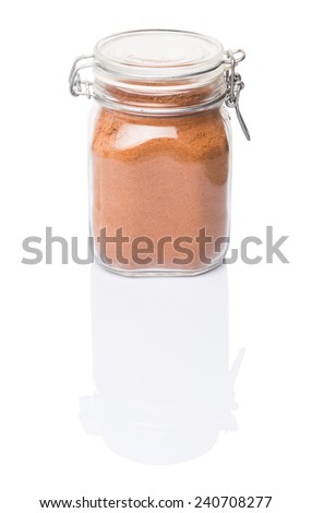 Instant chocolate drink powder in glass jar container over white background 