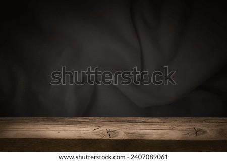 wooden table on an abstract dark background