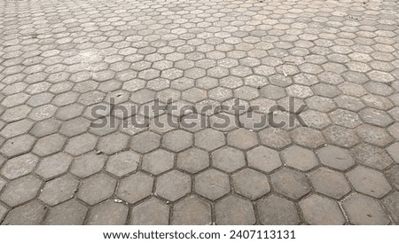 A neatly arranged hexagonal arrangement of paving blocks, photographed from a 45-degree angle.