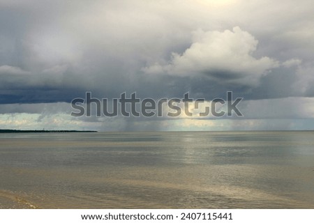 picture shows rain over the sea.