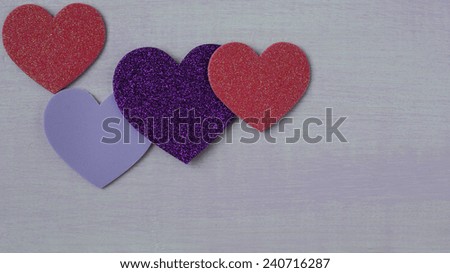 Hearts on Pink Wooden Background