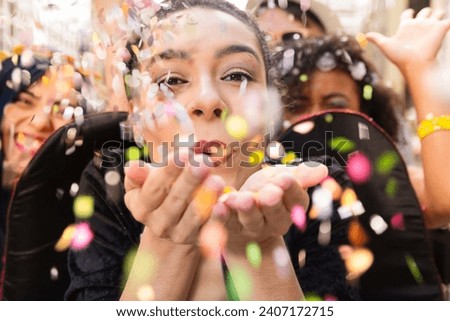 Carnaval party. Dressed group of Brazil people in the city Carnival. Brazilian woman in costume celebrating in parade festival. Royalty-Free Stock Photo #2407172715