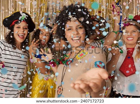 Hippie woman welcomes guests to the Carnival party in Brazil. Dressed group of brazilian friends enjoying Carnival Party and throwing confetti. Royalty-Free Stock Photo #2407172723