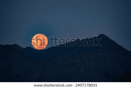 Full Moon Set happening right at the sunrise in Fujairah, UAE Royalty-Free Stock Photo #2407178031