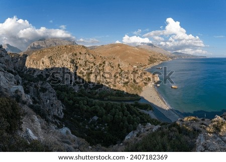 A picture of the Preveli Beach and the Preveli Palm Forest, as well as the nearby landscape and coast.