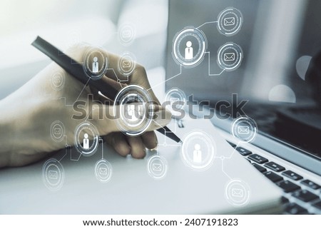 Social network concept with hand writing in notebook on background with laptop. Multiexposure