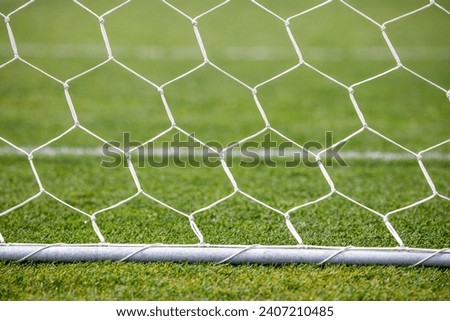 net on the goal of the football field Royalty-Free Stock Photo #2407210485