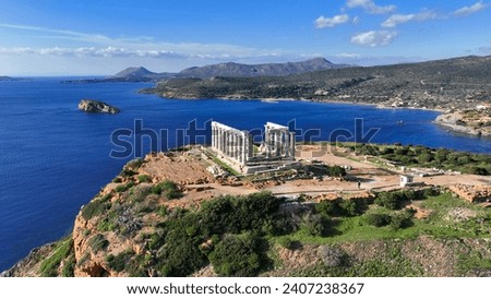 Aerial drone photo of iconic archaeological site of Cape Sounio and famous Temple of Poseidon built uphill overlooking Aegean sea, Attica, Greece Royalty-Free Stock Photo #2407238367