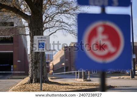 Two Handicap Signs One Behind the Other with the Background Sign in Focus