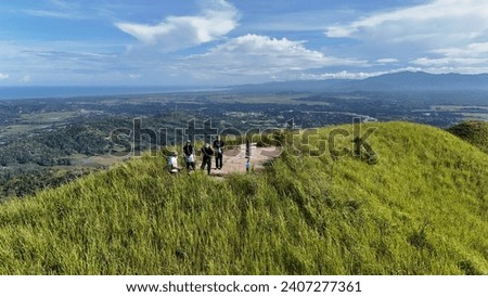 Hikers pictured on top of minonggui Hill peak taken using Dji mini 4 pro