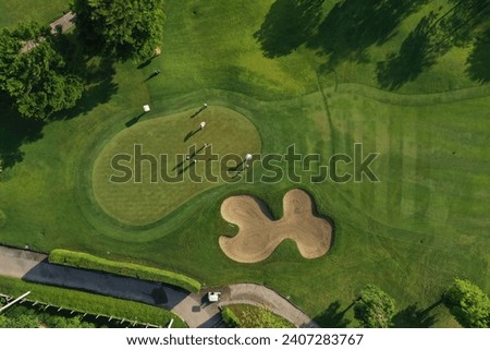 Golf course sport, green grass and trees on a golf field, fairway and putting green top view, Bangkok Thailand. bird view over Golf course in the tropical asia. Royalty-Free Stock Photo #2407283767