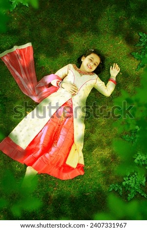 Beautiful Indian kid female fashion. Indian attire. Into the greens. lush green environment and atmosphere serenity.
