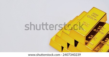 Close up photo a gold bar on white background, free space on left side for text.