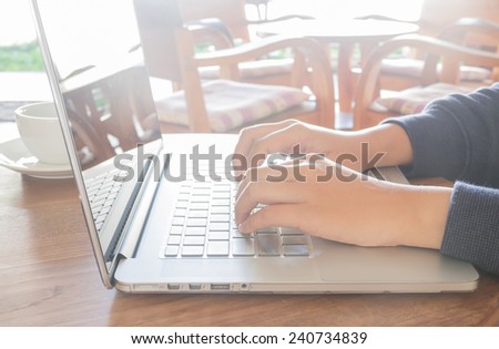 Working space with laptop and coffee cup on wood table