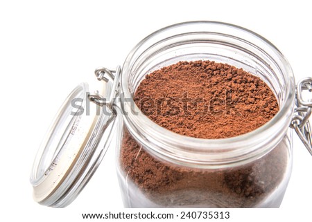 Instant coffee drink powder in glass jar container over white background 